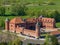 Tykocin castle on sunny day surrounded with green meadows and trees