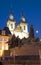 Tyn Church and statue monument Jan Hus at night Old Town Square