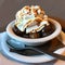 Tyoical italian mountain dessert: bowl of glazed chestnuts and whipped cream