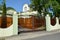 Type on gate and a barrier around a country house