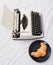 Typewriter and delicious croissant plate lay white bed sheets. Benefit being writer is comfortable inspiring workplace