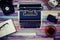 A typewriter and a retro phone on a colorful wooden table