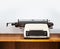 Typewriter on wooden table