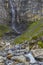 Typical alpine landscape with waterfalls, Swiss Alps near Klausenstrasse, Spiringen, Canton of Uri, Switzerland