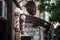 Typical American barbers pole seen in front of a barber shop. This pole is a vintage sign indicating presence of male hairdresser