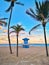 Typical american blue lifeguard house on Florida beach in Hollywood USA. Beautiful tropical Floridian landscape with tall palm