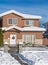 A typical american house in winter. Snow covered house