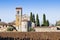 Typical ancient italian Romanesque church immersed in the Tuscany countryside near a Cemetery
