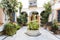 Typical Andalusian patio with fountain and plants