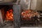 Typical Argentinian barbecue or asado. Burning wood in the grill and red hot coals