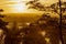 A typical autumn golden coloured sunrise seen from one of the hills outside Maastricht with a view over the valley of the river Me