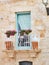 Typical balcony in a stone house of southern Italy.