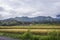 Typical Balinese landscape with traditional houses, banana trees, rice fields and Bukit Nampo hill in Karangasem.