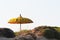 Typical Balinese sun umbrella standing on the beach. Salento, Italy