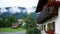 Typical Bavarian Home with misty Alpine Mountains