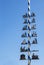 Typical Bavarian maibaum or maypole in blue and white colors wit