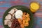 Typical Brazilian food dish with rice, red beans, pork and carrot salad and braised corn