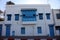 Typical building with white walls, blue doors and windows in Sidi Bou Said, Tunisia