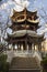 Typical Chinese park with a big pagoda structure in blue sky