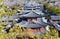 Typical chinese temples roofs among urban houses