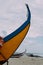 Typical colourful Moliceiro fishing boats on the beach in Espinho, Portugal