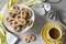 Typical cookies from The Netherlands called Krakeling, with cup of tea and flower