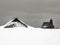 Typical cottage and the church of Snowy Mary on Velika planina