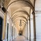 typical covered walkway, the portico of placa do comercio, lisbon