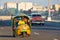 A typical cuban motorbike taxi known as cocotaxi travels along the Malecon seaside avenue in Havana