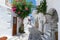 The typical cycladic, whitewashed alleys with colorful flowers at Parikia on the island of Paros