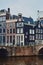 Typical dutch architecture, canal and bridge in Amsterdam