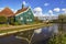 Typical Dutch village Zaanstad in spring sunny day.