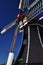 Typical Dutch windmill detail against a blue sky, Holland.