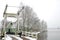 Typical Dutch winter landscape with lake and bridge