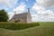 Typical English country cottage. Rural countryside farmhouse.