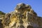 Typical exposed sedimentary sand stone cliff face on the Praia da Oura beach in Albuferia