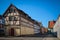 Typical fachwerk houses of old Klaipeda, Lithuania medieval town and cobbled pavement street. German style buildings of