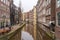 Typical famous water canal and dancing houses in empty Amsterdam downtown without people due to Coronavirus Covid-19