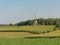 Typical flemish ardennes farmscape with historic windmill