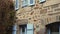 Typical french breton stone house facade with colorful window and door