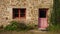 Typical french breton stone house facade with colorful window and door