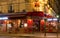 The typical French cafe Le Petit Suffren at night, Paris, France.