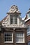 Typical gabled houses on Damrak street in Amsterdam, Holland