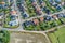 Typical German new housing development in the flat countryside of northern Germany between fields and meadows