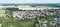 Typical German new housing development in the flat countryside of northern Germany between a forest and fields and meadows