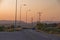 Typical greek coastal road at sunset with one pickup driving by