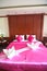 Typical hotel room with queen size pink bad with Thai style