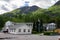 Typical houses in the village Flam in Norway surrounded by mountains