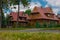 Typical houses or villas in Zakopane, a known polish summer and winter retreat place. Main road and wooden houses next to it,