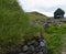 Typical Icelandic fishing village with grass-roofed homes and fish drying racks